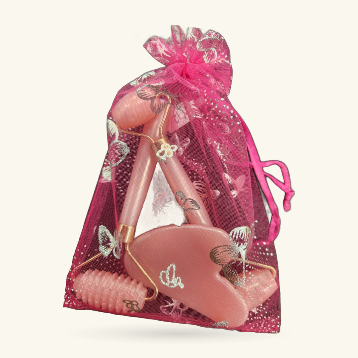 3pc pink roller massage set with floral design, includes face roller, gua sha tool, and decorative gift bag
