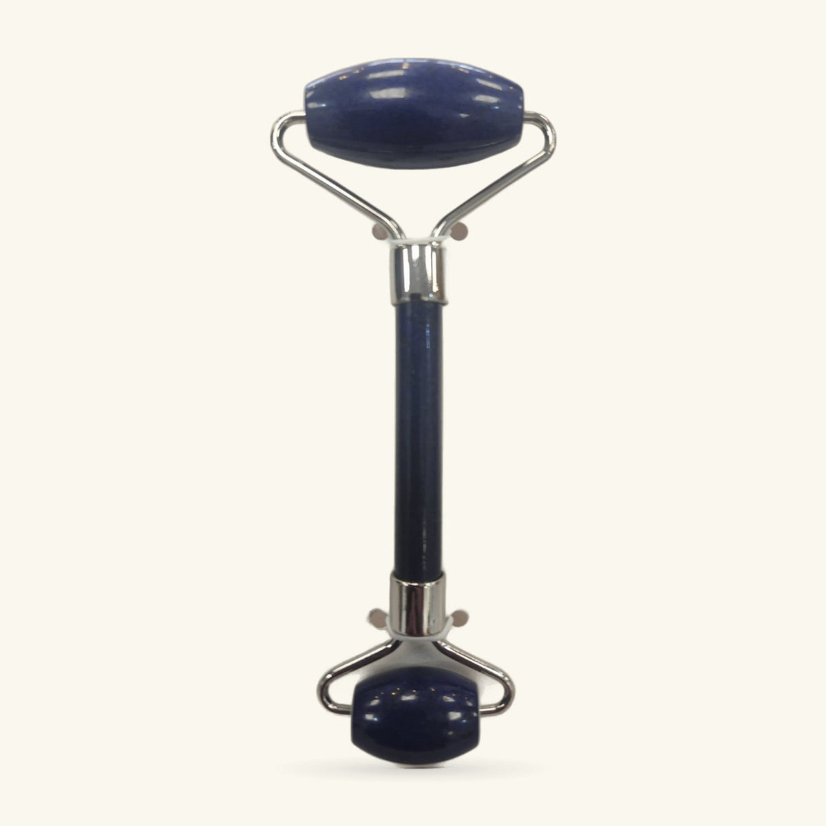 Lapis Lazuli facial massage roller with chrome handles and base, dark blue stone rollers top and bottom