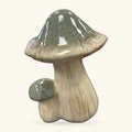 Green capped ceramic mushroom ornament with cream stem and small round base detail