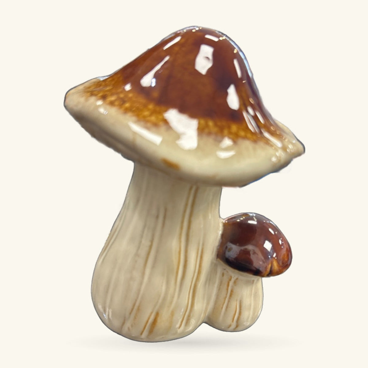 Brown capped mushroom ceramic ornament with cream stem and white spots