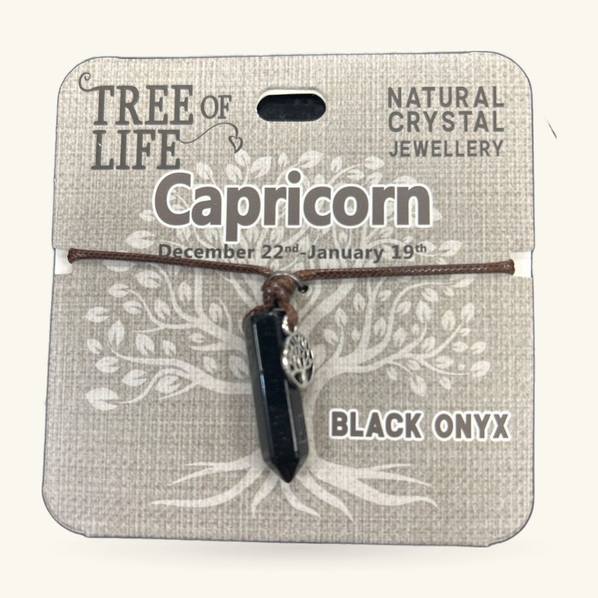 Black onyx point pendant on brown cord with silver tree of life charm, Capricorn zodiac necklace