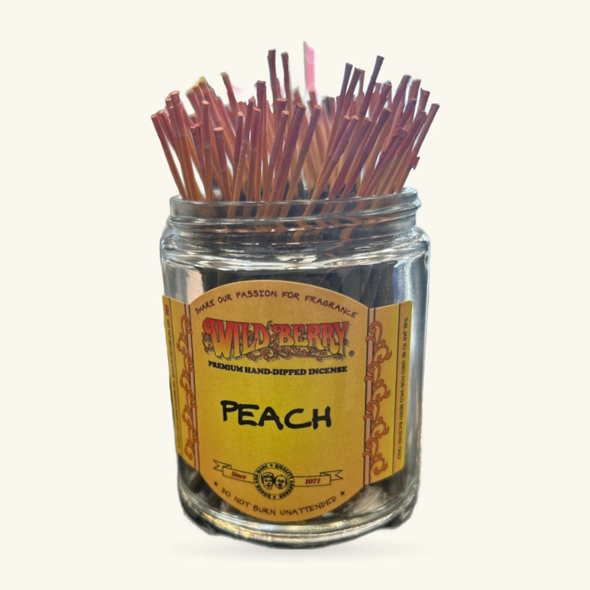 Jar of Wild Berry Peach Shorties incense sticks with reddish-brown hand-dipped sticks fanned upright