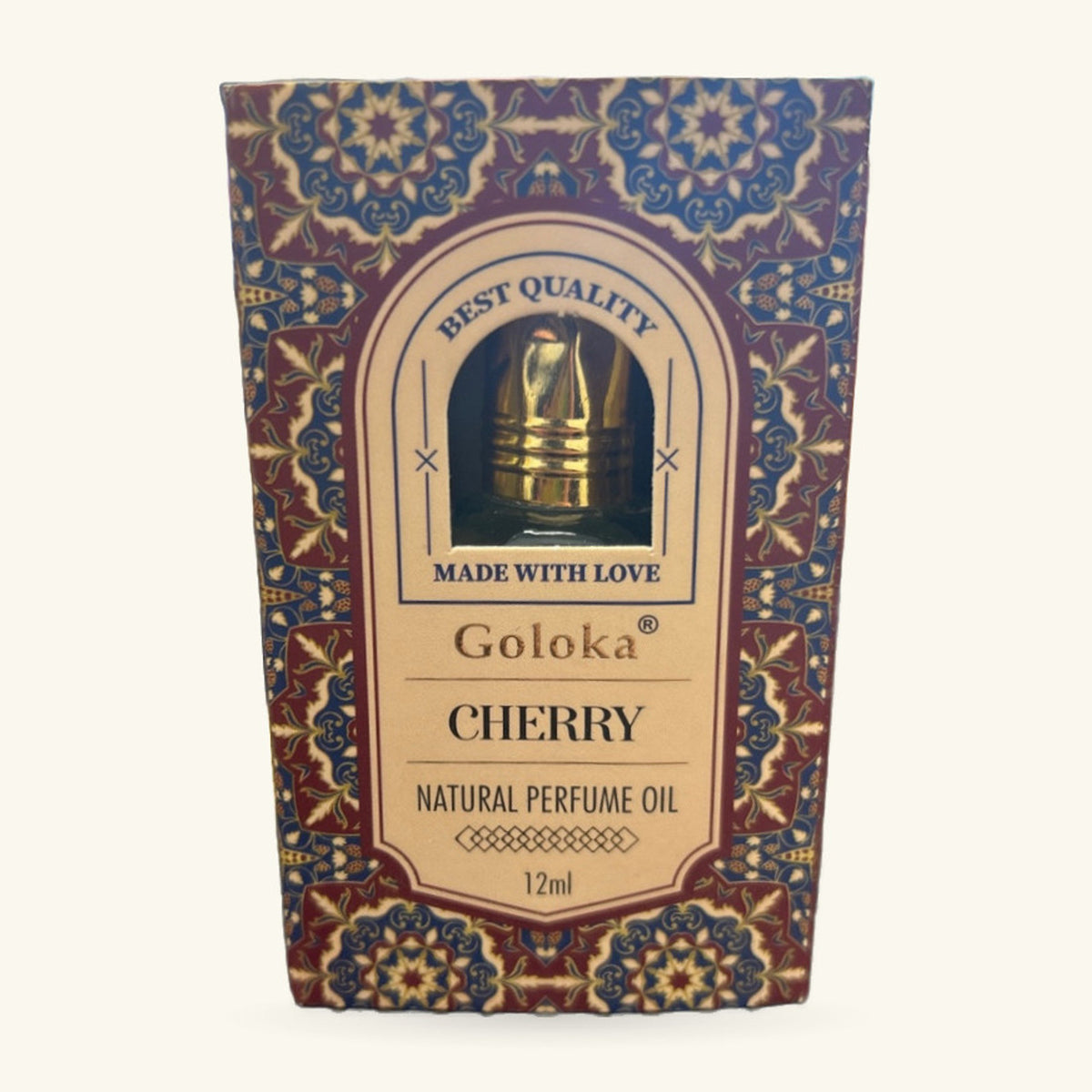 Goloka Cherry Natural Perfume Oil 12ml in ornate burgundy and blue packaging with a brass applicator cap visible through a circular window.