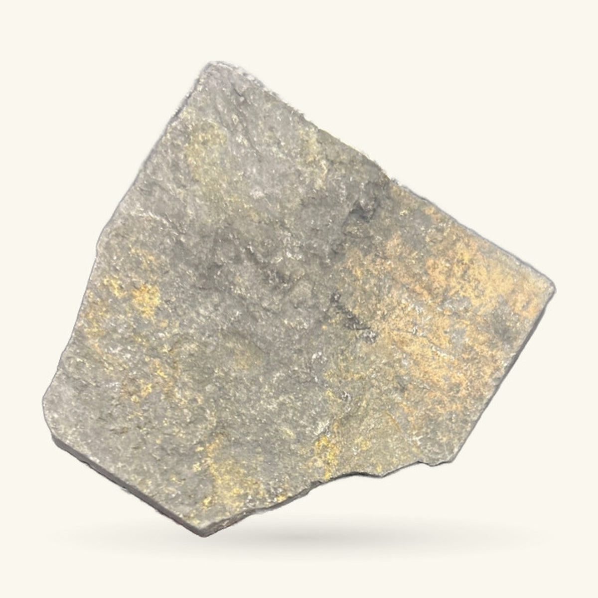 Raw shungite chunk, grey and tan, roughly triangular with natural edges and weathered surface