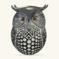 Black and white patterned large owl ornament with amber eyes and detailed metallic finish