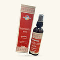 Sacred Elements Palo Santo and Rose room spray: cream box with red panel and patterned trim, with dark glass bottle and spray nozzle beside it
